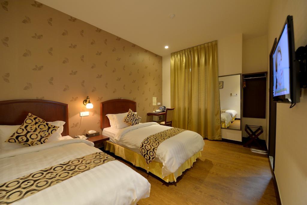 Asiana Hotel Kota Kinabalu Quarto foto